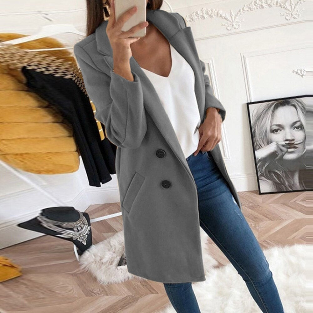 Gray single-breasted mid-thigh coat featuring structured notch lapels, two-button fastening, and angled pockets.
