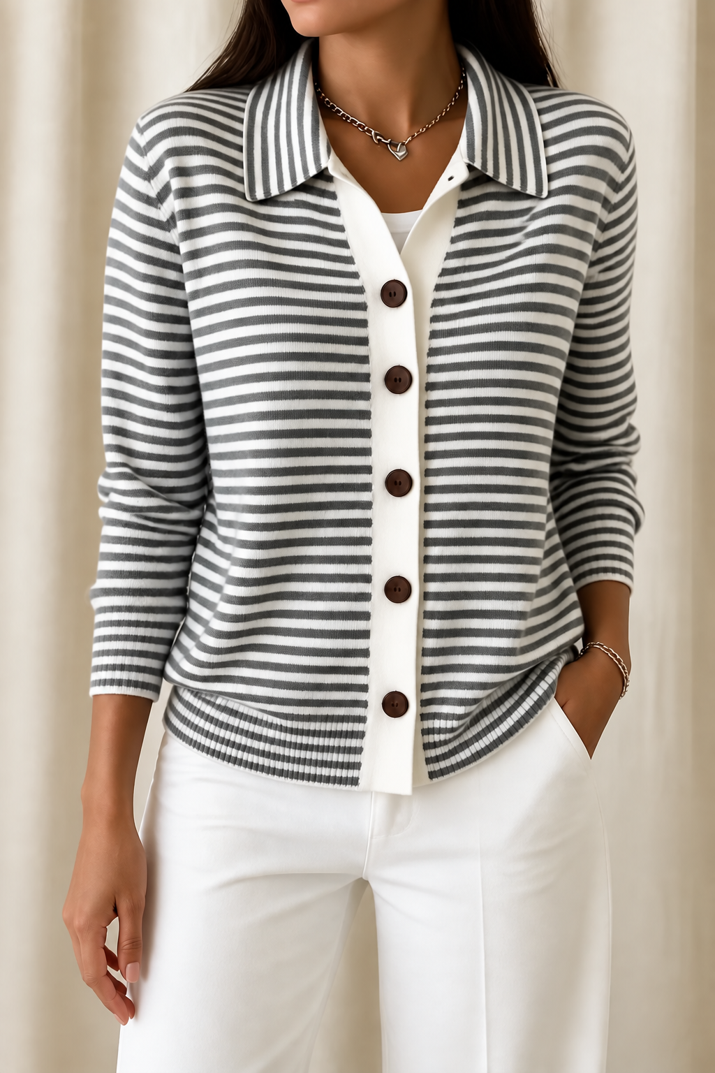 Three-quarter view of the taupe-and-cream striped cardigan showing its rounded hem and button-front design.