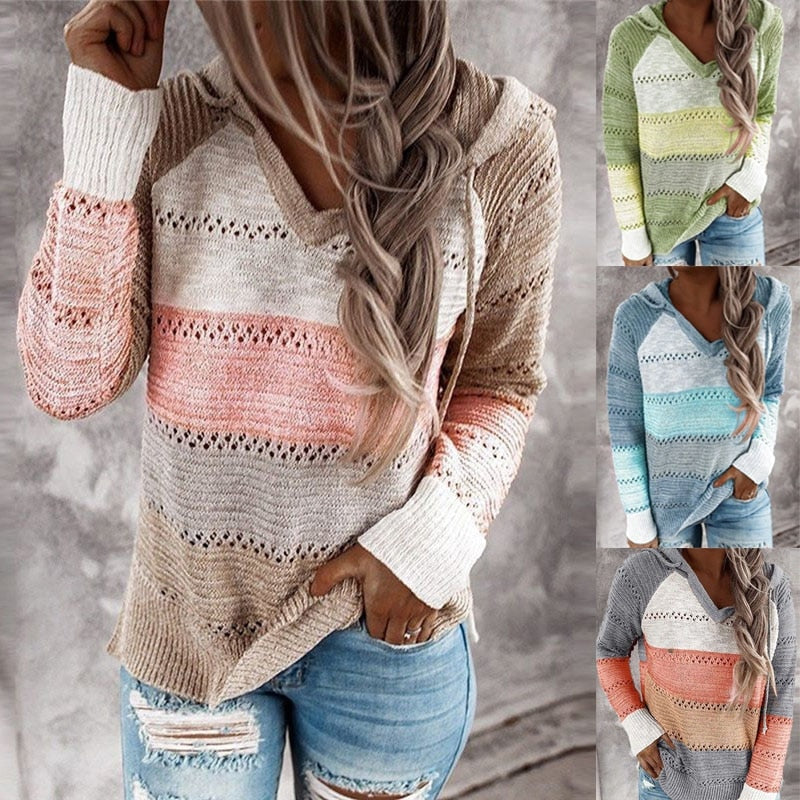 Striped openwork hooded sweater in beige, pink, cream, and gray, shown with jeans and contrasting white cuffs.