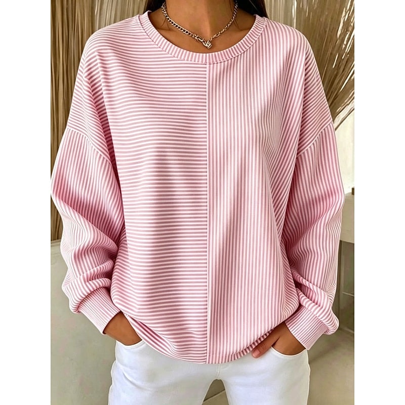 Front view of a pink and white mixed-stripe sweatshirt, featuring horizontal stripes across the upper left front and vertical stripes on the right, with a crew neck and long relaxed sleeves.