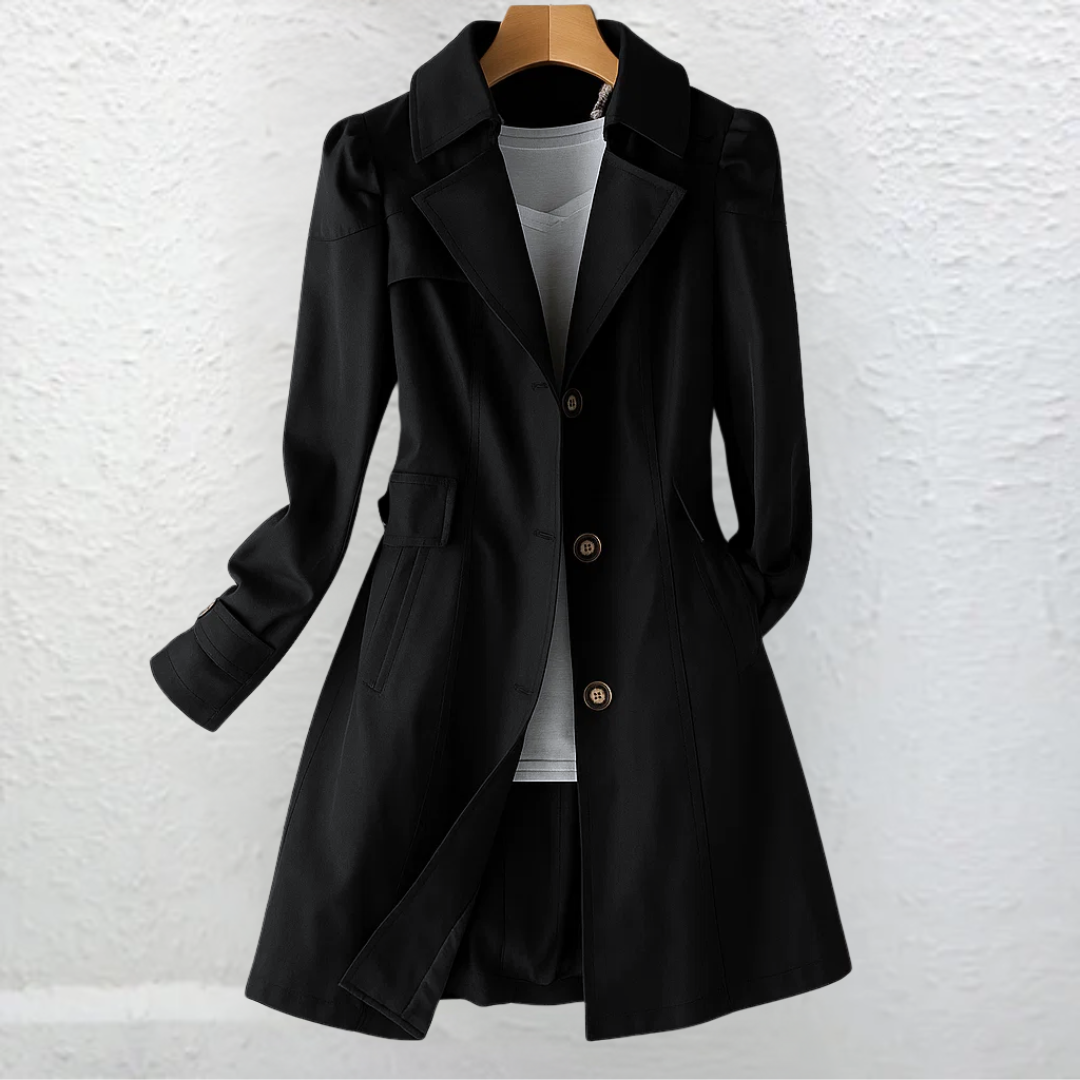 Front view of a black tailored trench coat with a wide notched collar, three-button closure, long sleeves, waist shaping, and mid-thigh length.