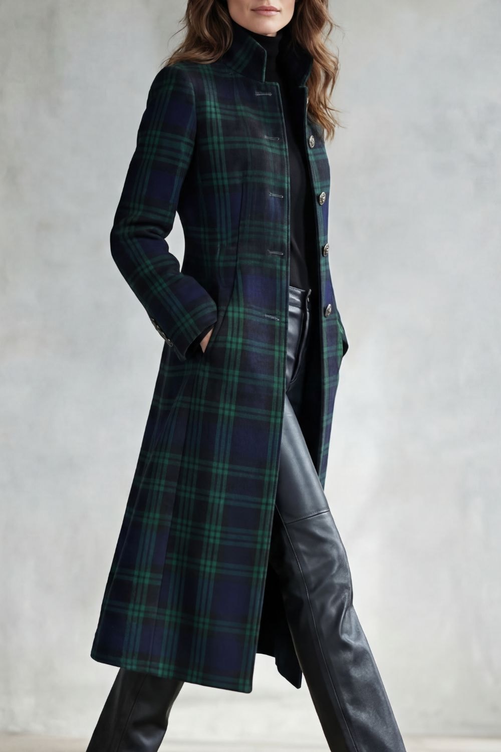 Side view of the tartan check coat showing its longline cut, stand collar, long sleeve, and side pockets.