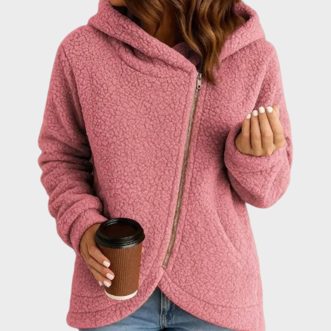 Pink teddy textured jacket with an oversized hood, relaxed fit, curved hem, and front zip closure.