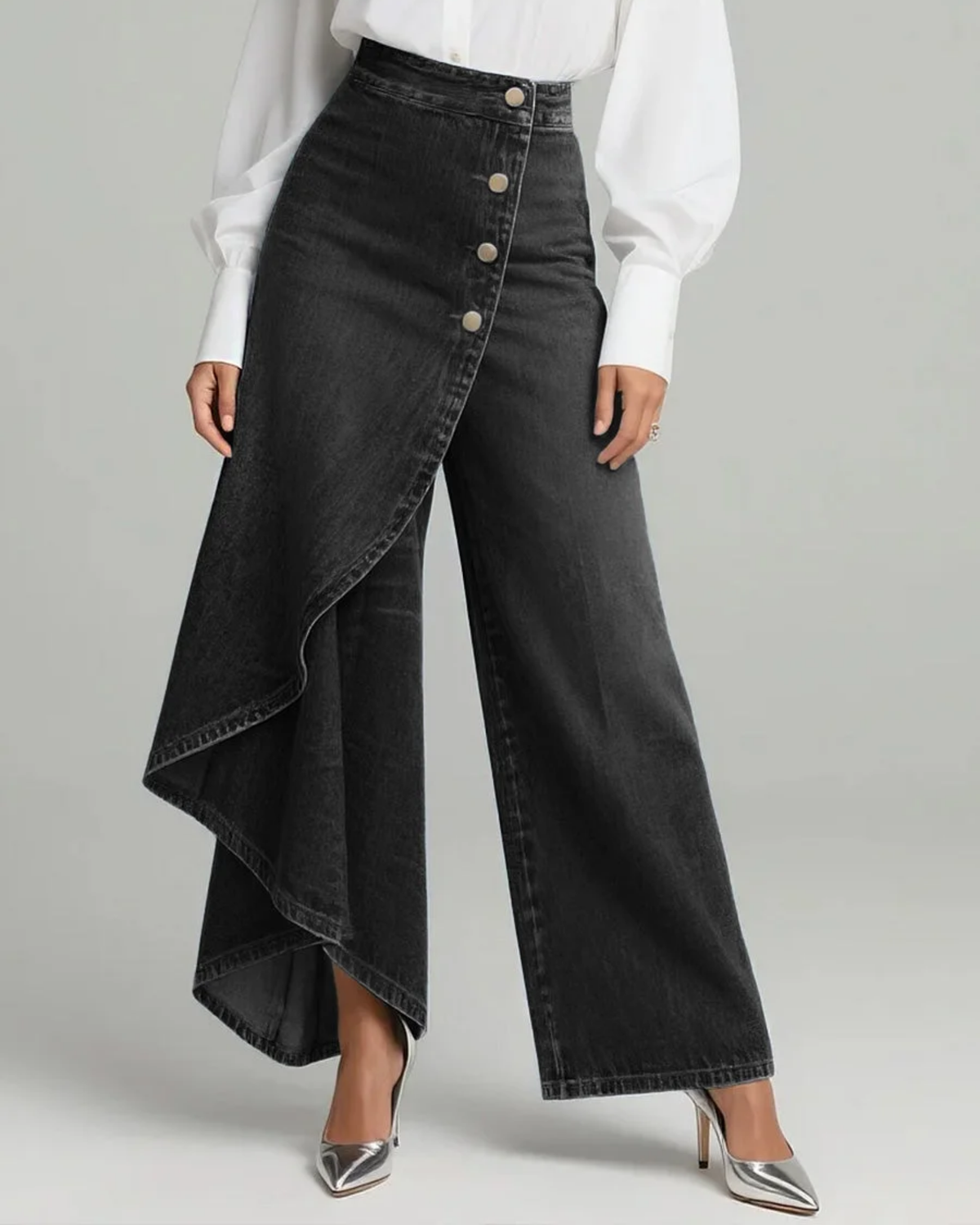 Front view of the same asymmetric wide-leg wrap trousers in black, showing the high-rise waist, contrasting seam lines, and row of front buttons.