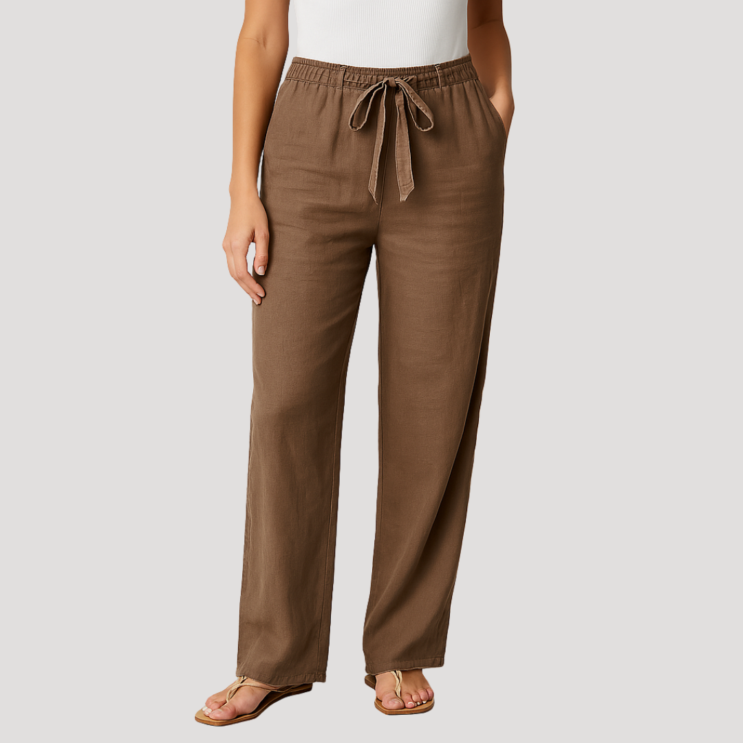 Brown full-length wide-leg pants featuring an elastic drawstring waist and side pockets, styled with sandals.
