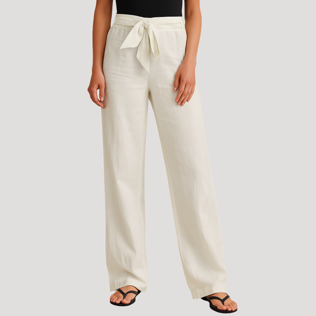 Cream wide-leg pants with a prominent tied drawstring at the elastic waist and full-length legs.