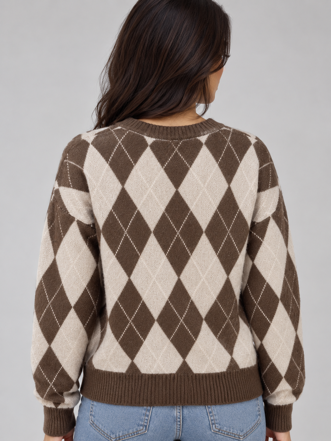 Back view showing the jumper’s full brown and cream diamond pattern, crew neckline, long sleeves and ribbed hem.