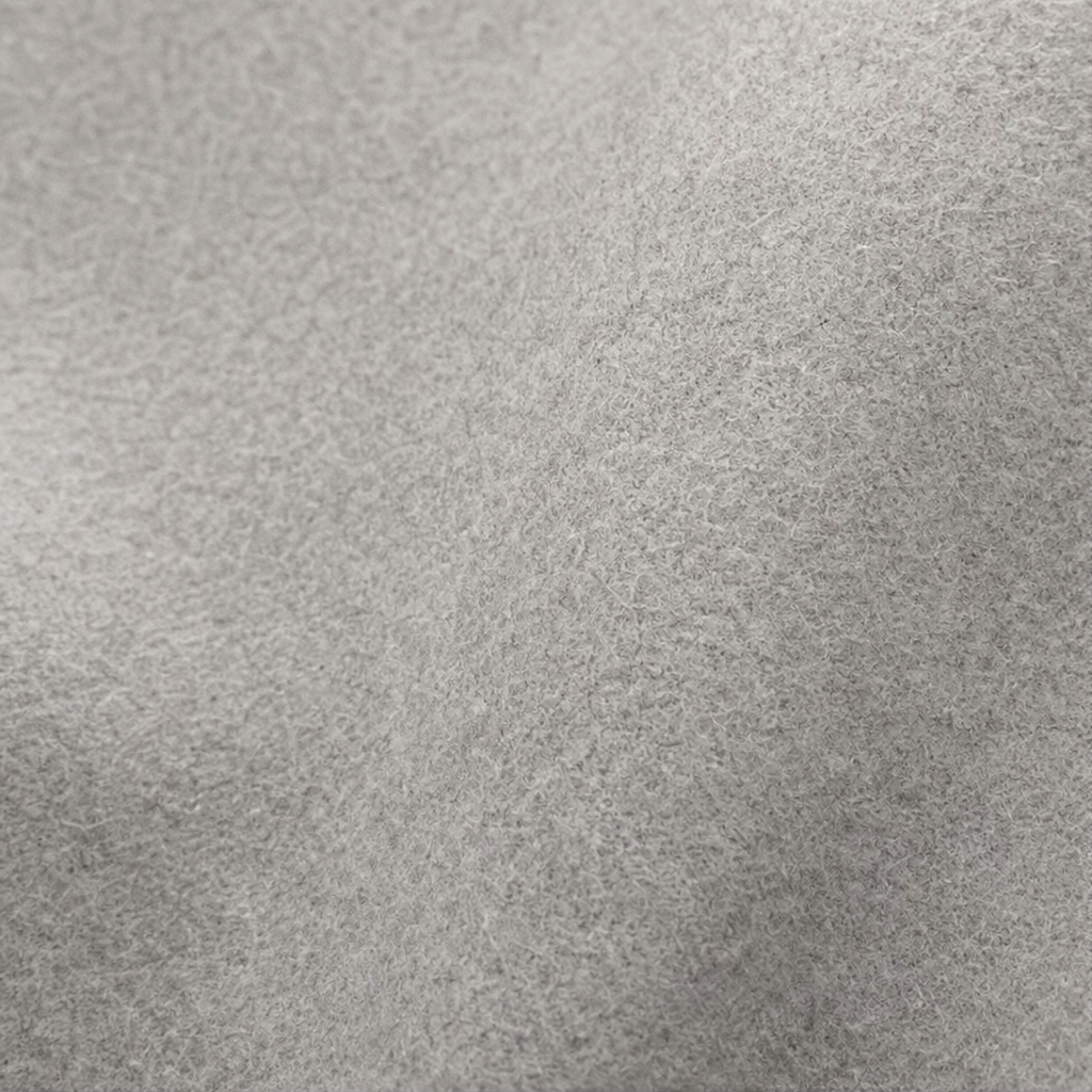 Close-up of the light gray jacket’s soft-looking surface texture.