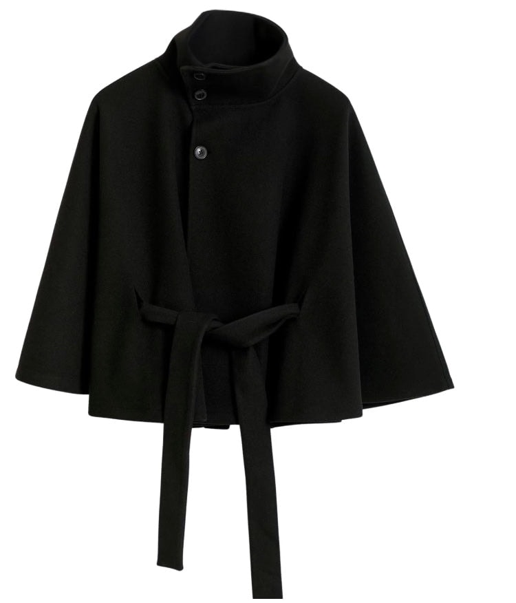 Black cape jacket displayed against a plain background with a stand collar, button front, wide sleeves, and hanging belt ends.