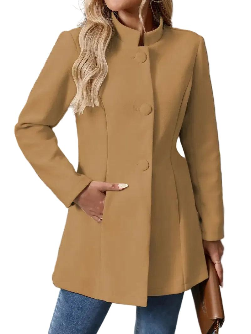 Camel-colored longline coat worn fastened, showing the structured collarless neckline, vertical button closure, long sleeves, and side pocket.