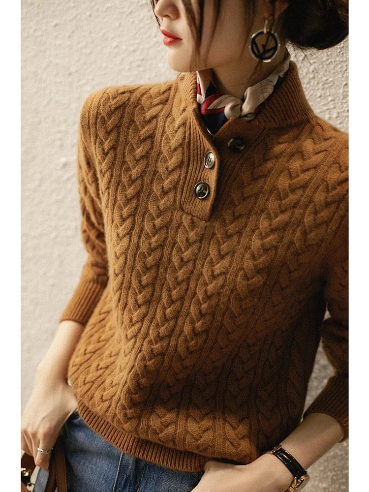 Angled view of the brown sweater highlighting the raised cable texture across the chest and sleeves.