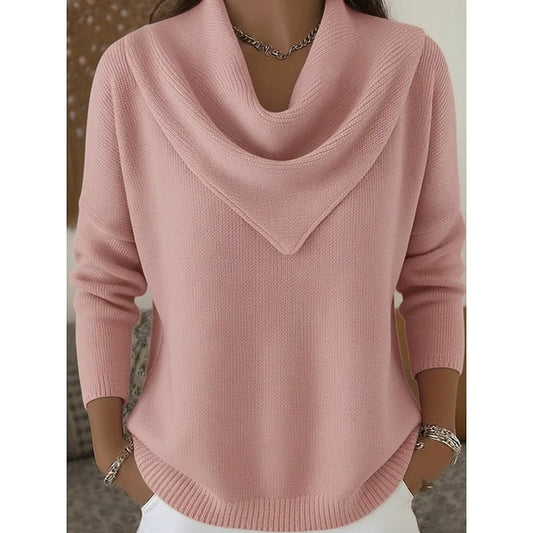 Front view of a pink cowl neck sweater with a draped neckline, long sleeves, ribbed cuffs, and a curved ribbed hem.