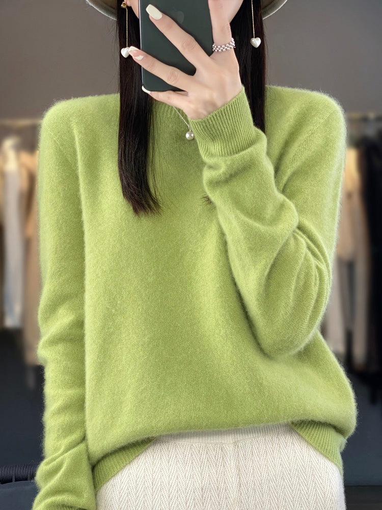 Lime green crew neck sweater with a soft relaxed shape, long sleeves, and ribbed cuffs.