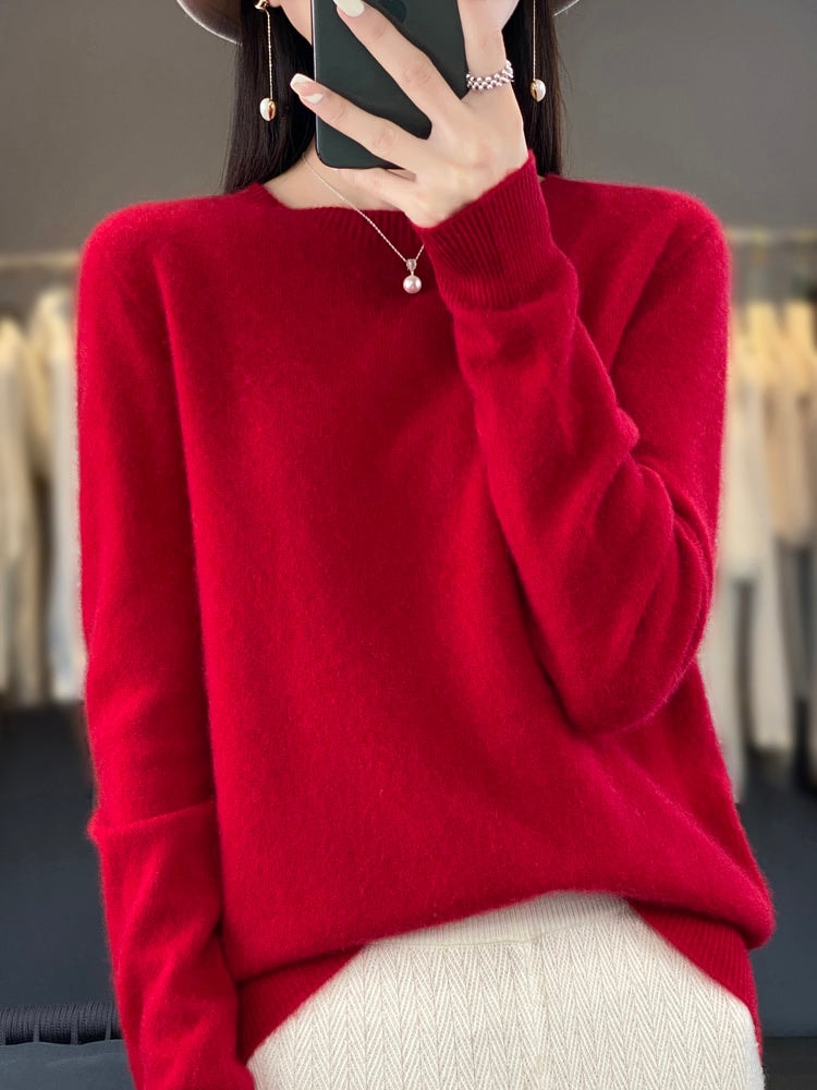 Vivid red crew neck sweater with a relaxed silhouette, long sleeves, and ribbed cuffs.