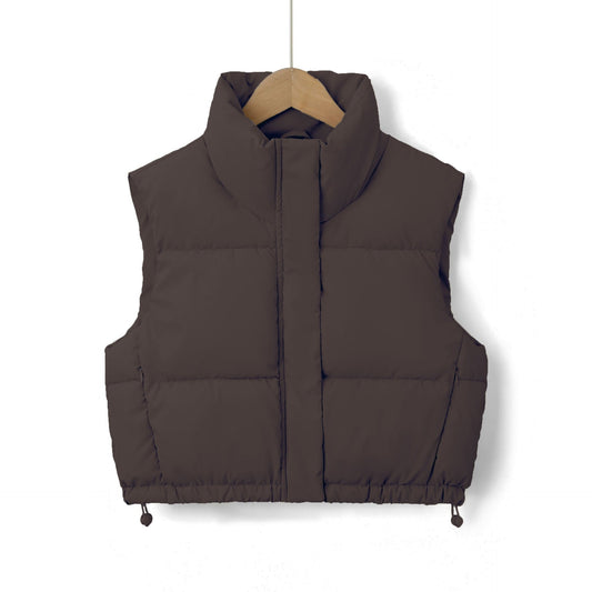 Dark brown cropped quilted puffer vest with a high stand collar, concealed front zip, and adjustable drawstring hem.