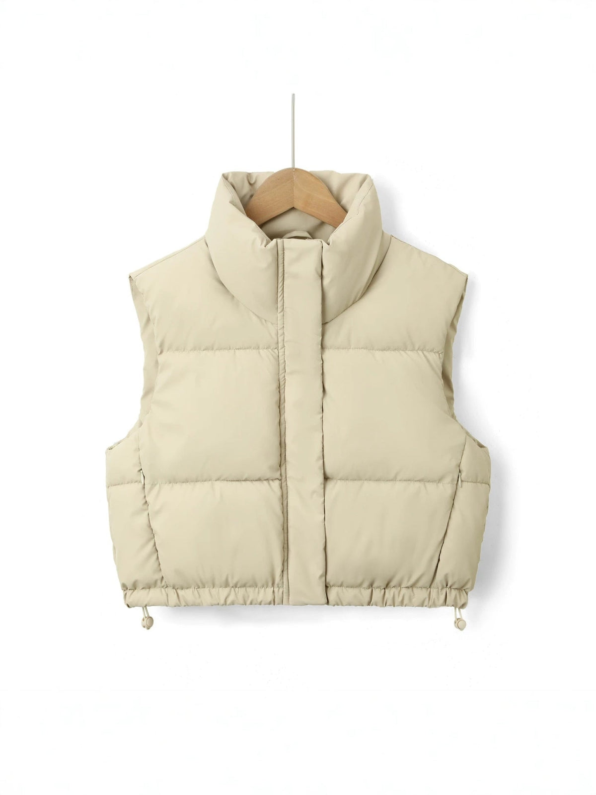 Light cream cropped puffer vest with padded horizontal quilting and a raised stand collar.