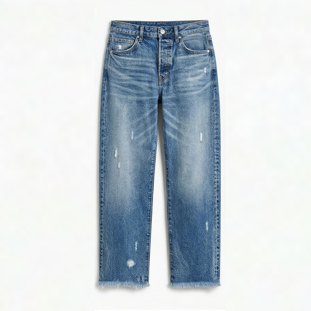 Full front view of medium blue cropped straight-leg jeans with whiskering, scattered distressing, and raw hems.