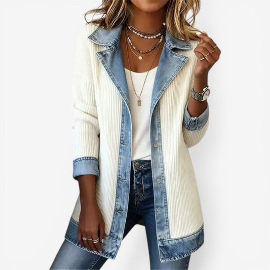 Cream longline jacket with a notched denim-look collar, contrasting trim, rolled cuffs, front buttons, and lower patch pockets.