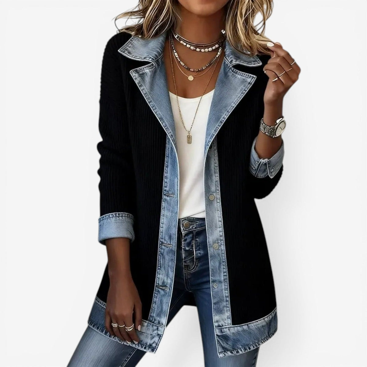Black longline jacket featuring a notched denim-look collar, blue contrasting trim, rolled three-quarter cuffs, and button front.