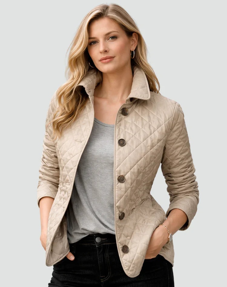 Light beige diamond-quilted jacket shown open over a gray top, highlighting its structured collar, button front, long sleeves, and side pockets.