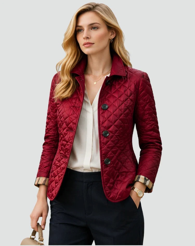 Burgundy diamond-quilted button-front jacket with a contrasting collar, rolled cuffs, long sleeves, and side pockets, styled over a white blouse.