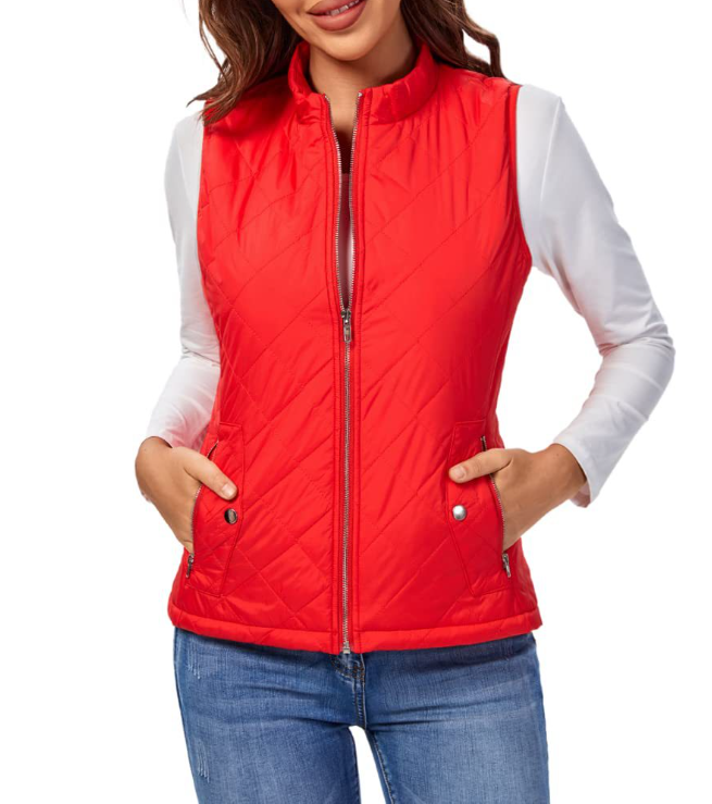 Bright red diamond-quilted sleeveless vest zipped closed over a white long-sleeve shirt, with hands in the pockets.
