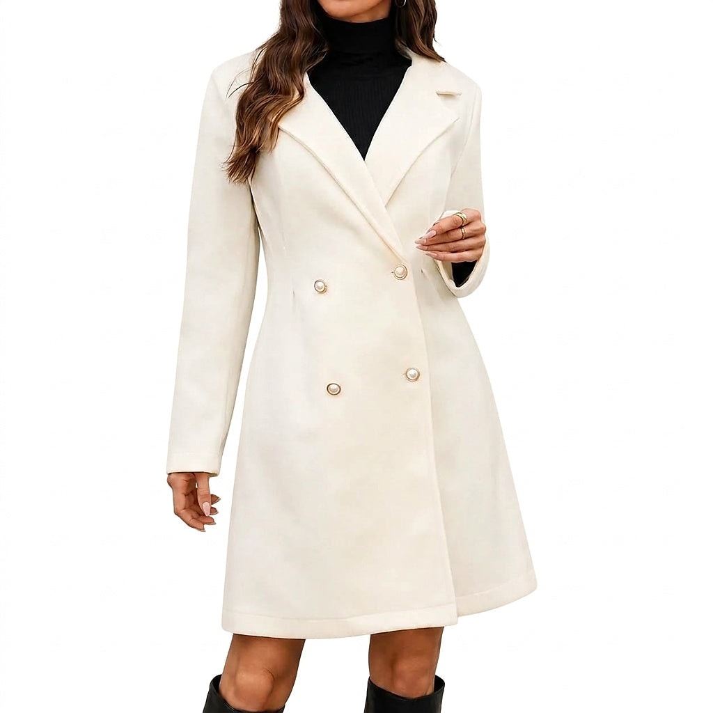Front view of an ivory knee-length double-breasted coat with long sleeves and wide lapel collar, styled over a black high-neck top.