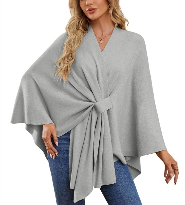 Light gray poncho wrap with a rectangular front tie and long, pointed draped panel.