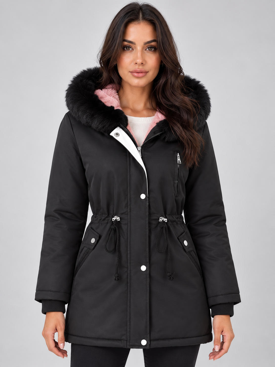 Front view of a black longline winter parka with a faux fur-trimmed hood, adjustable drawstring waist, flap pockets, and zipped chest pocket.