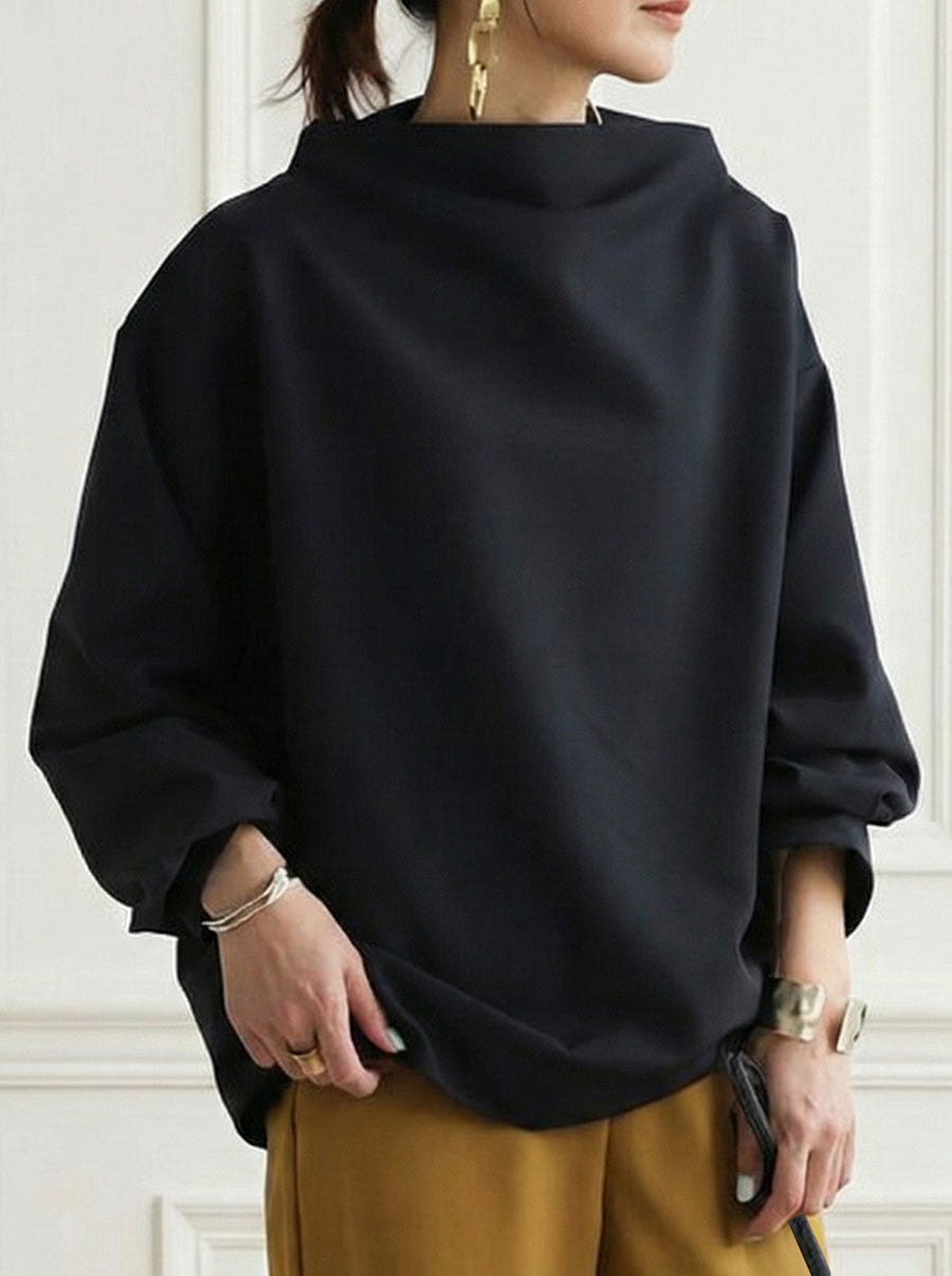 Front view of a solid black relaxed sweatshirt with a sculptural high neckline, long sleeves, and gathered cuffs.