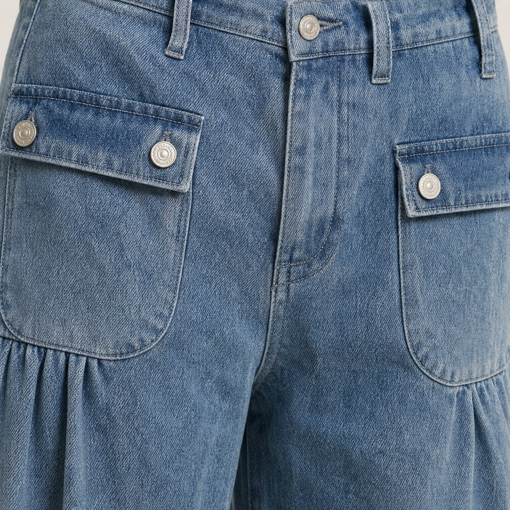 Detailed front view of the high waistband, belt loops, button closure, and dual flap cargo pockets.