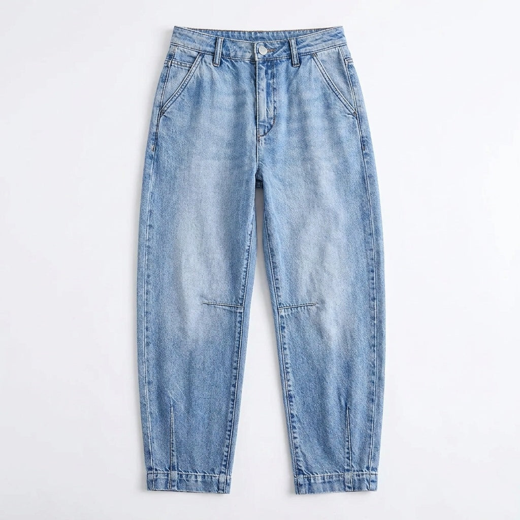 Full front view of the light-blue high-waisted cropped barrel-leg jeans laid flat, showing the pockets, button closure, curved legs, knee seams, and cropped hems.