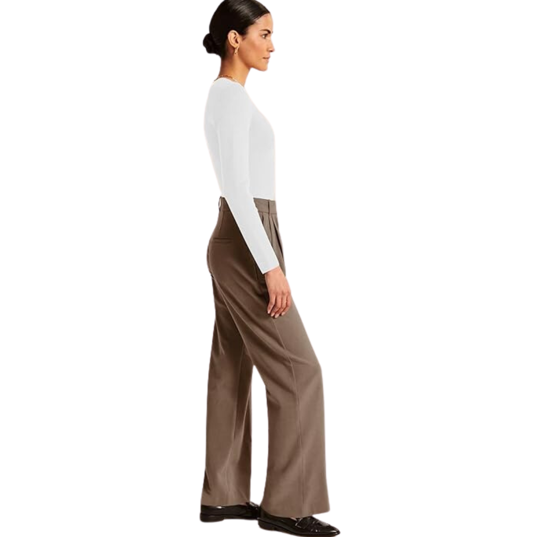 Side view of taupe high-waisted trousers showing the relaxed wide-leg silhouette and drape.