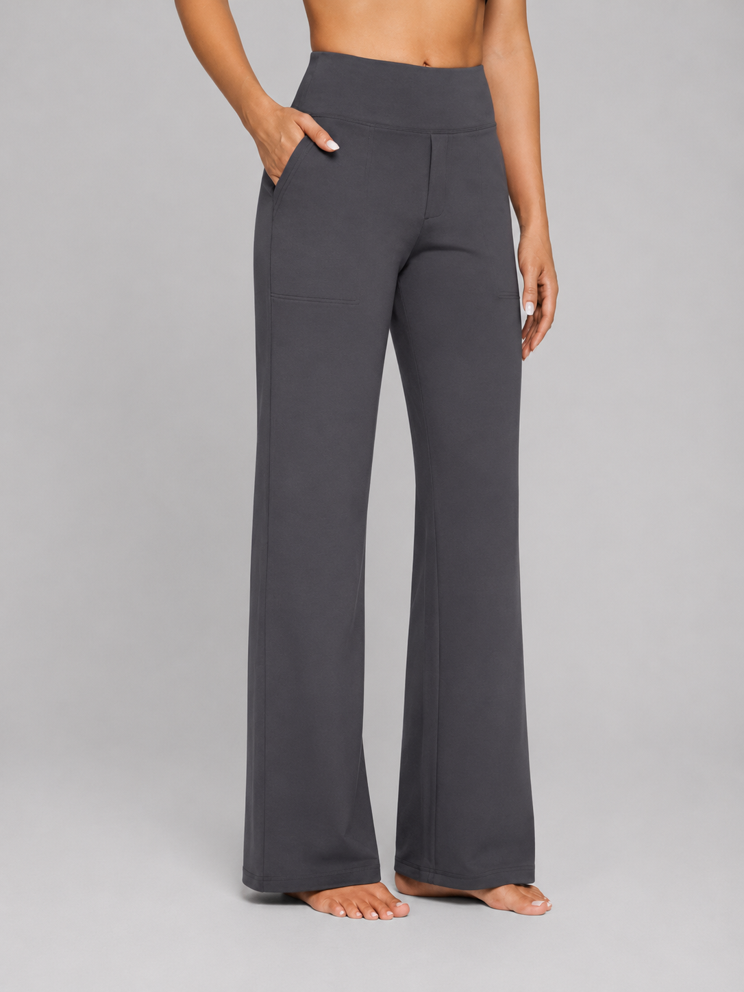 Front view of the wide-leg trousers in charcoal gray, with a high waistband and side pocket.