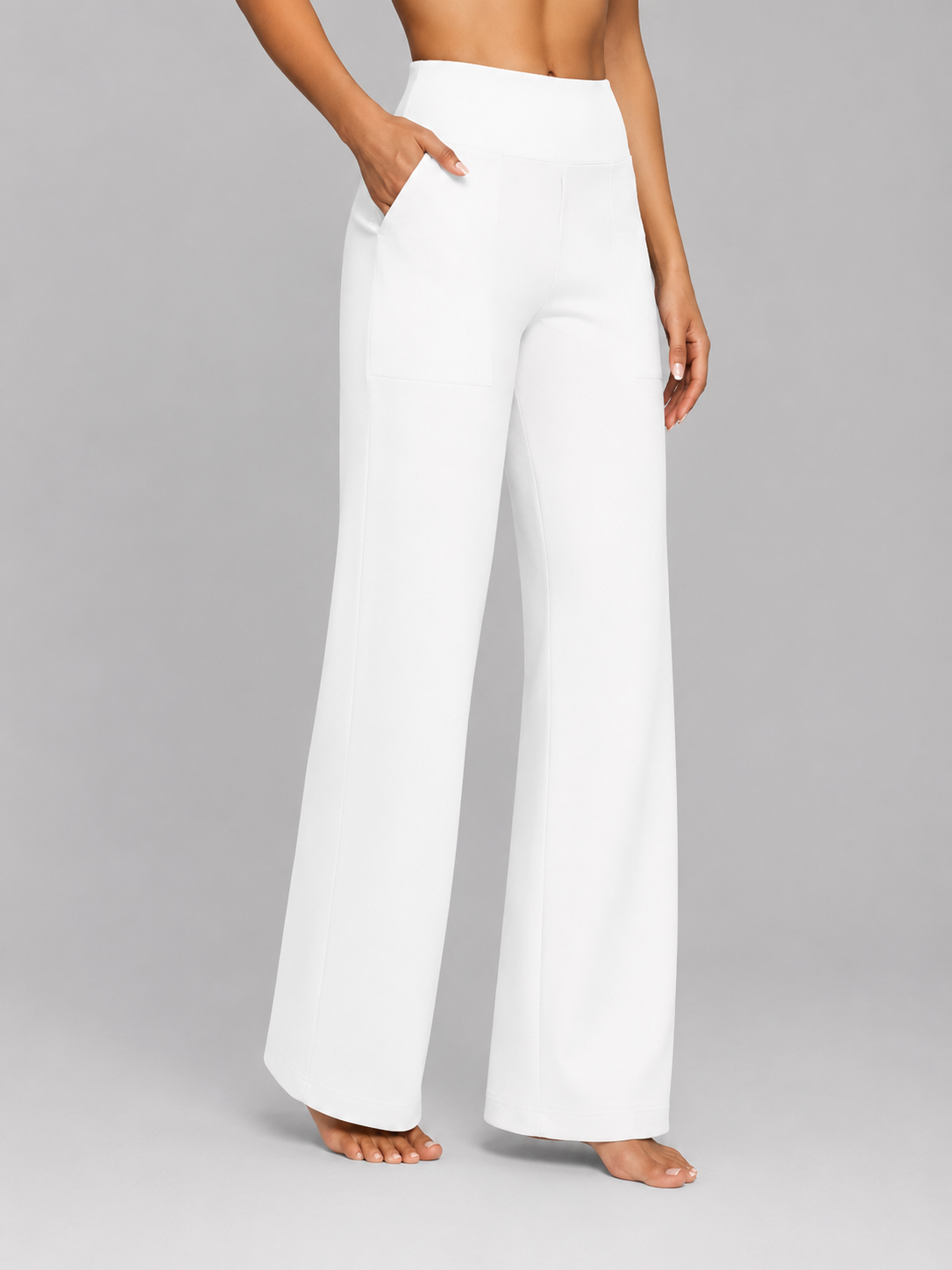 Front view of the wide-leg trousers in white, highlighting the relaxed full-length silhouette.