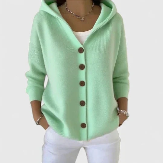 Mint green hooded button-front cardigan with long sleeves and a relaxed fit, worn over a white top.
