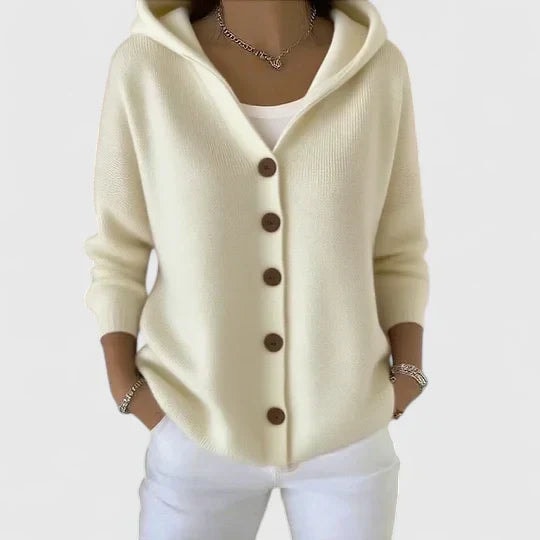Cream hooded cardigan with brown buttons, long sleeves, and an easy layered silhouette.