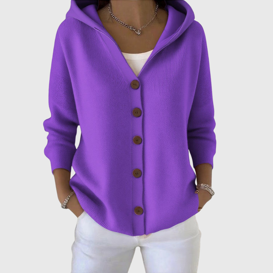 Bright purple hooded button-front cardigan worn open at the neckline over a white top.