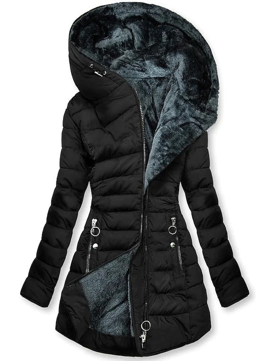 Black quilted longline puffer coat with a large hood lined in plush faux fur, front zip closure, long sleeves, and multiple zip pockets.