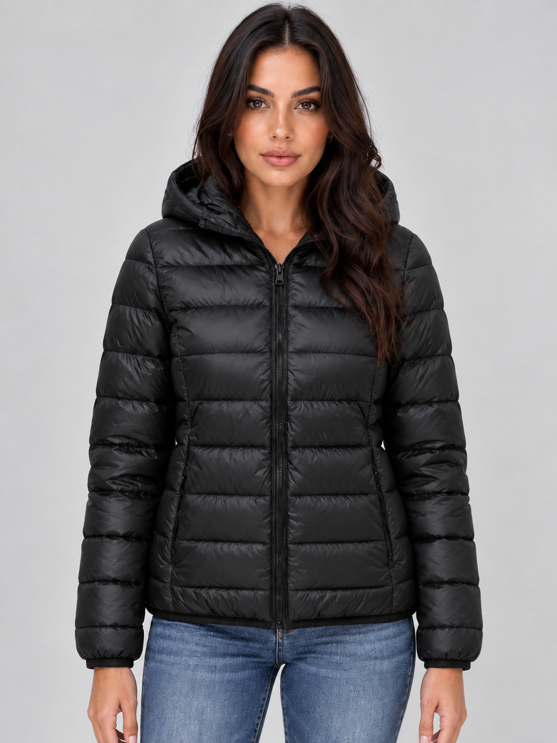 Front view of a black women's hooded quilted puffer jacket with horizontal quilting, long sleeves, full front zip, and two side pockets.