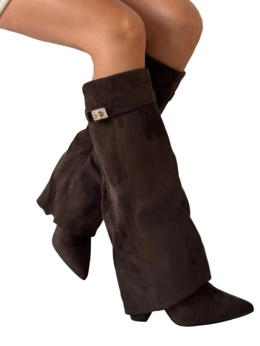 Dark brown knee-high boots in a crossed side view, highlighting the pointed toe, block heel, and shaft accent.