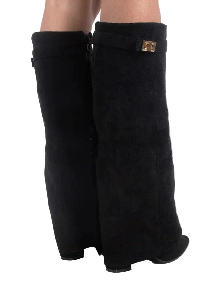 Back view of black knee-high boots showing the tall shafts, rear seams, pointed toes, and small block heels.