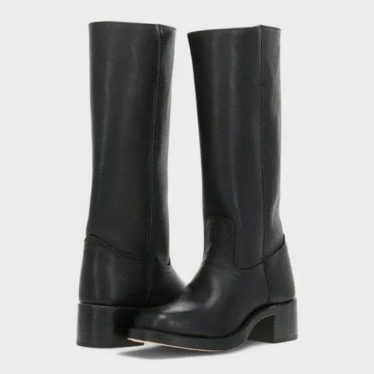 Black knee-high pull-on boots with rounded toes and sturdy block heels shown in a front three-quarter view.