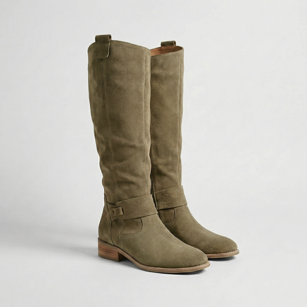 Olive taupe knee-high boots with relaxed gathered shafts, ankle buckle details and rounded toes shown in a front three-quarter view.