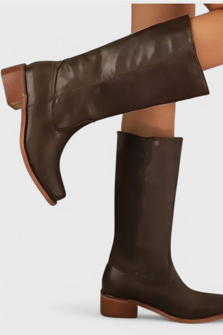 Dark brown knee-high boot shown in a lifted side view, highlighting the tall pull-on shaft and low block heel.