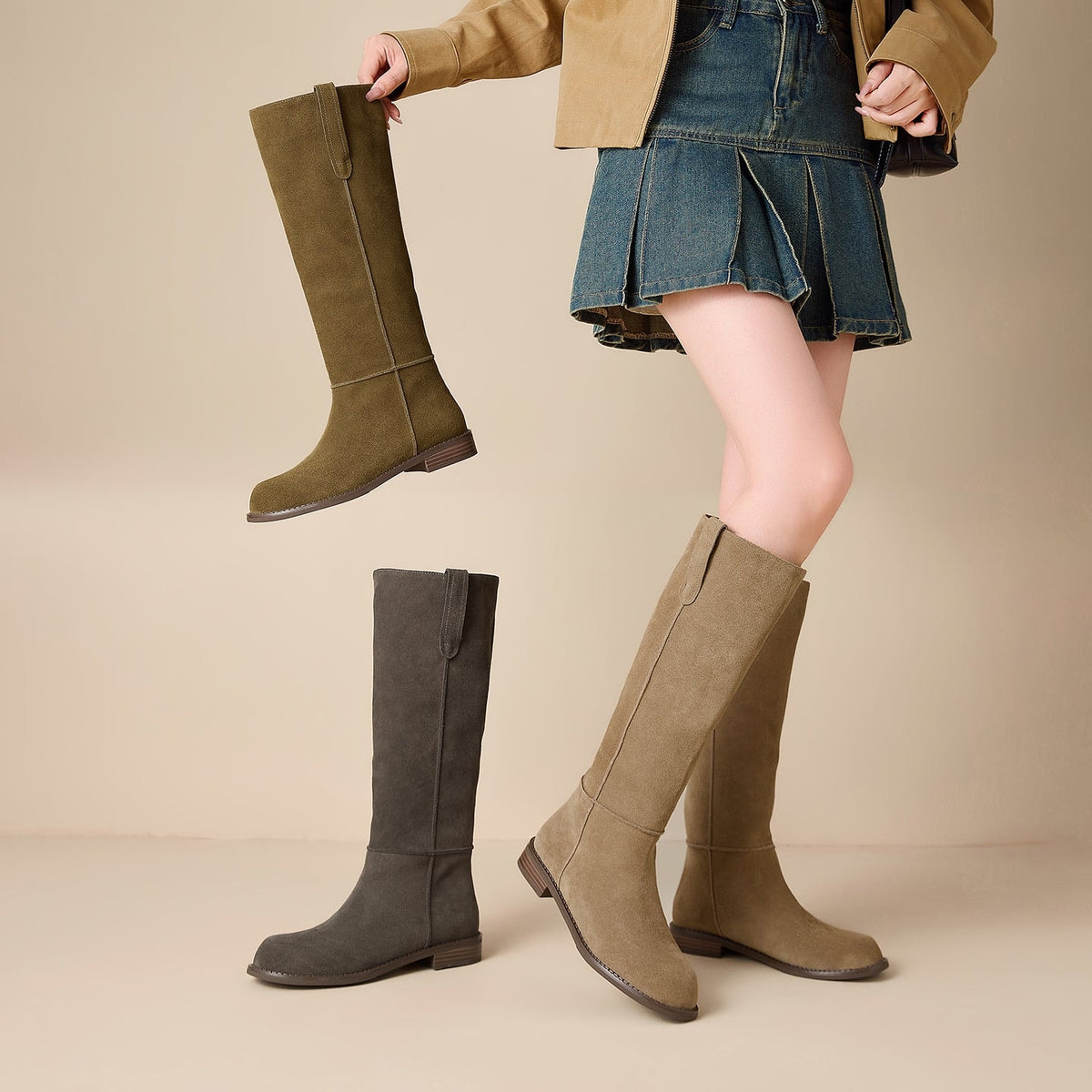 Three color options of the knee-high boots displayed together, including olive-tan, charcoal gray, and tan pairs with low heels.