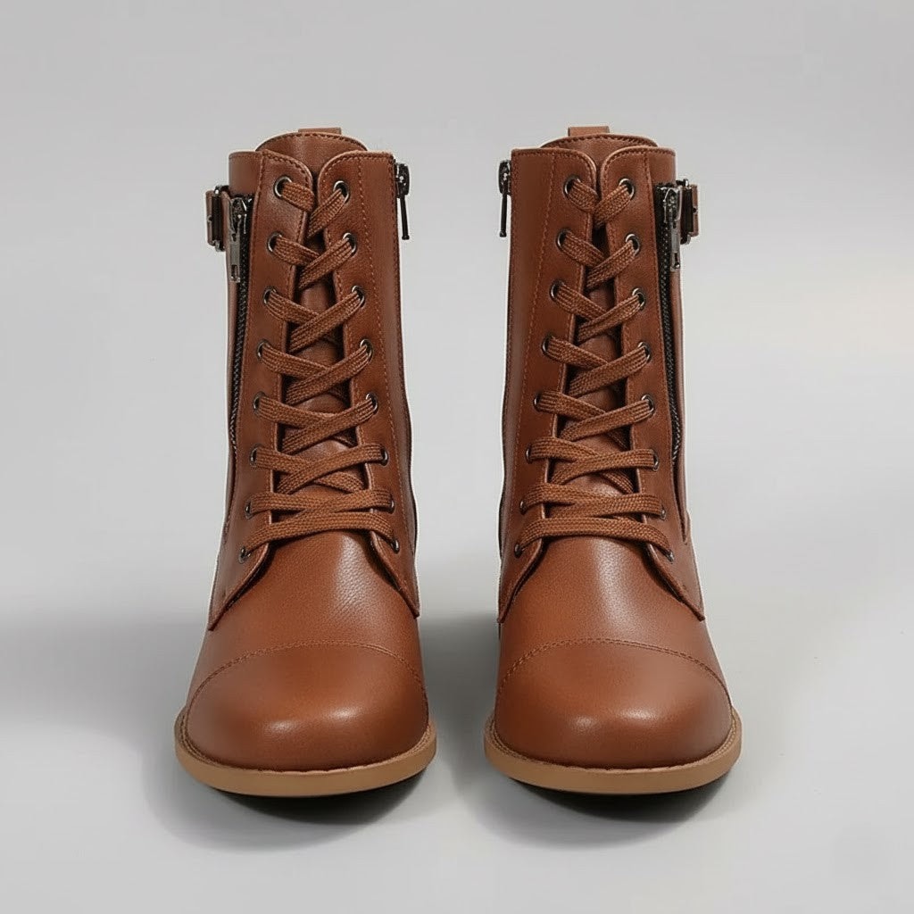 Front view of brown lace-up ankle boots with rounded toes, side zips, buckled ankle straps, and low block heels.