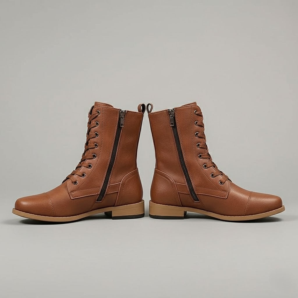 Side profile of brown ankle boots showing the full-length side zips, lace-up fronts, ankle straps, and low heels.