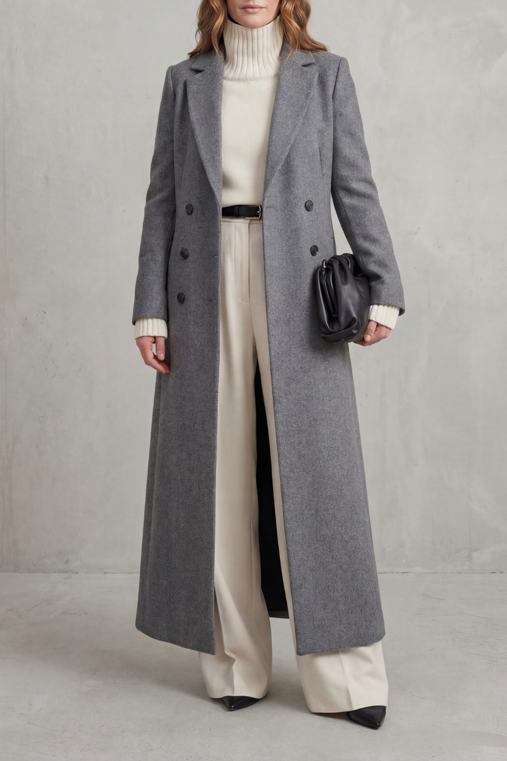 Front view of a gray long double-breasted coat with notched lapels, long sleeves, and a clean tailored silhouette.