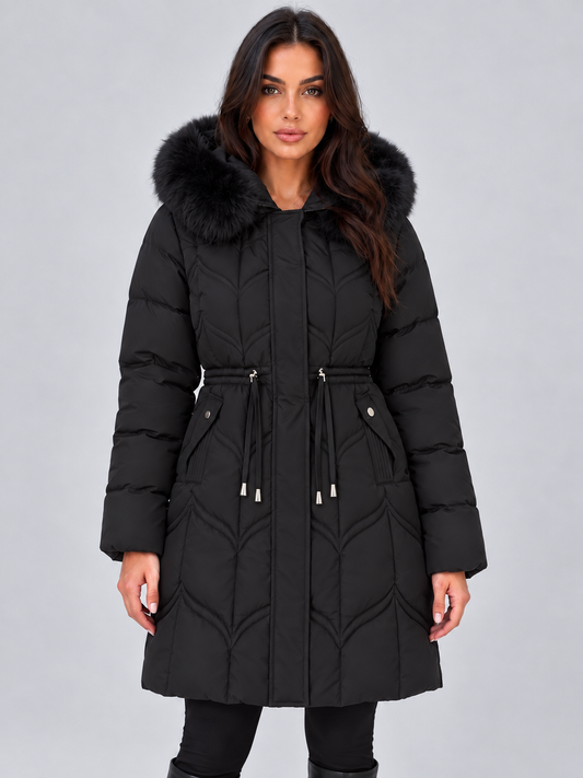Front view of a long black hooded puffer coat with faux fur trim, quilted panels, adjustable drawstring waist, concealed front closure, and multiple pockets.